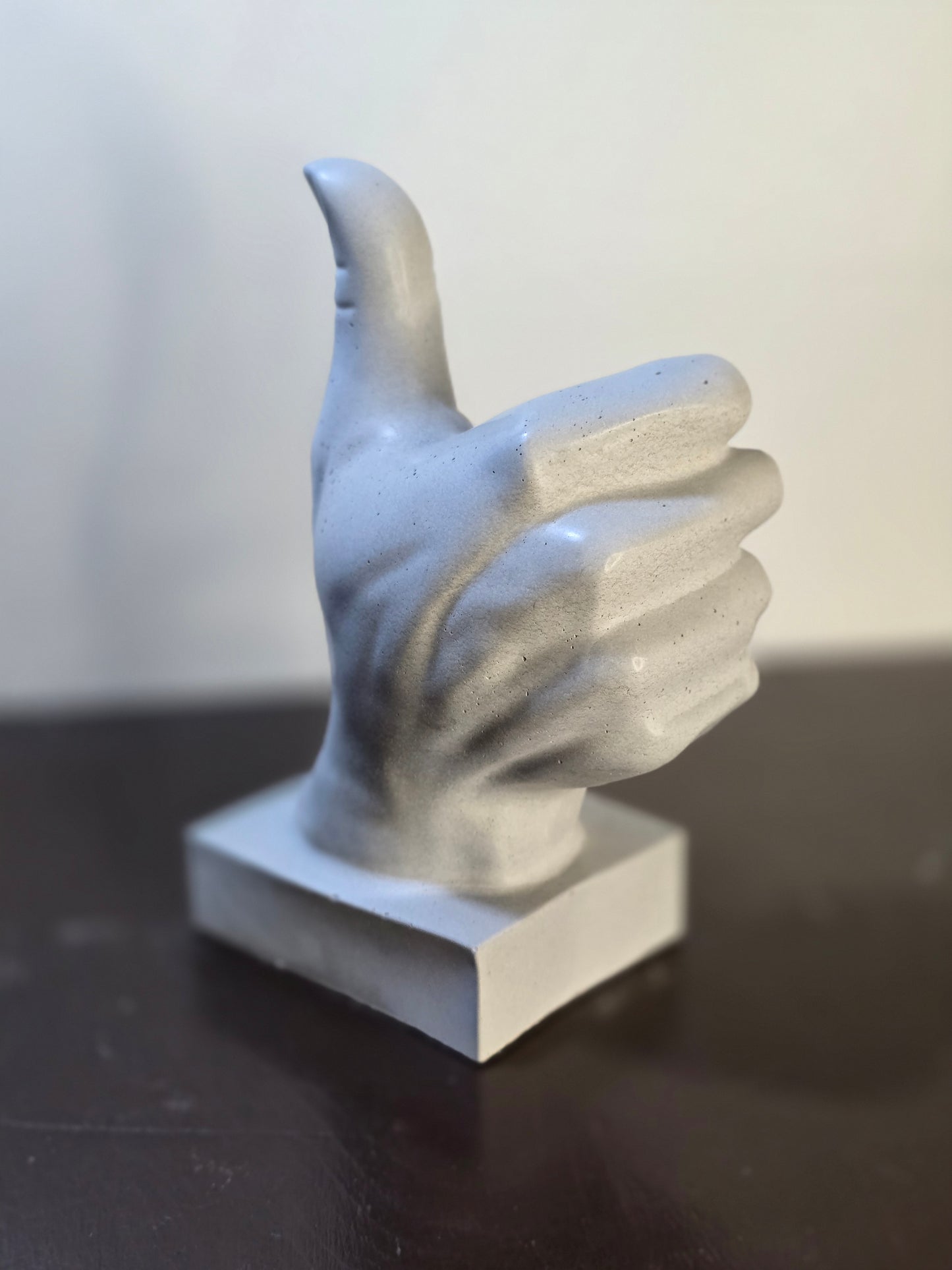 Hands with thumbs up Concrete