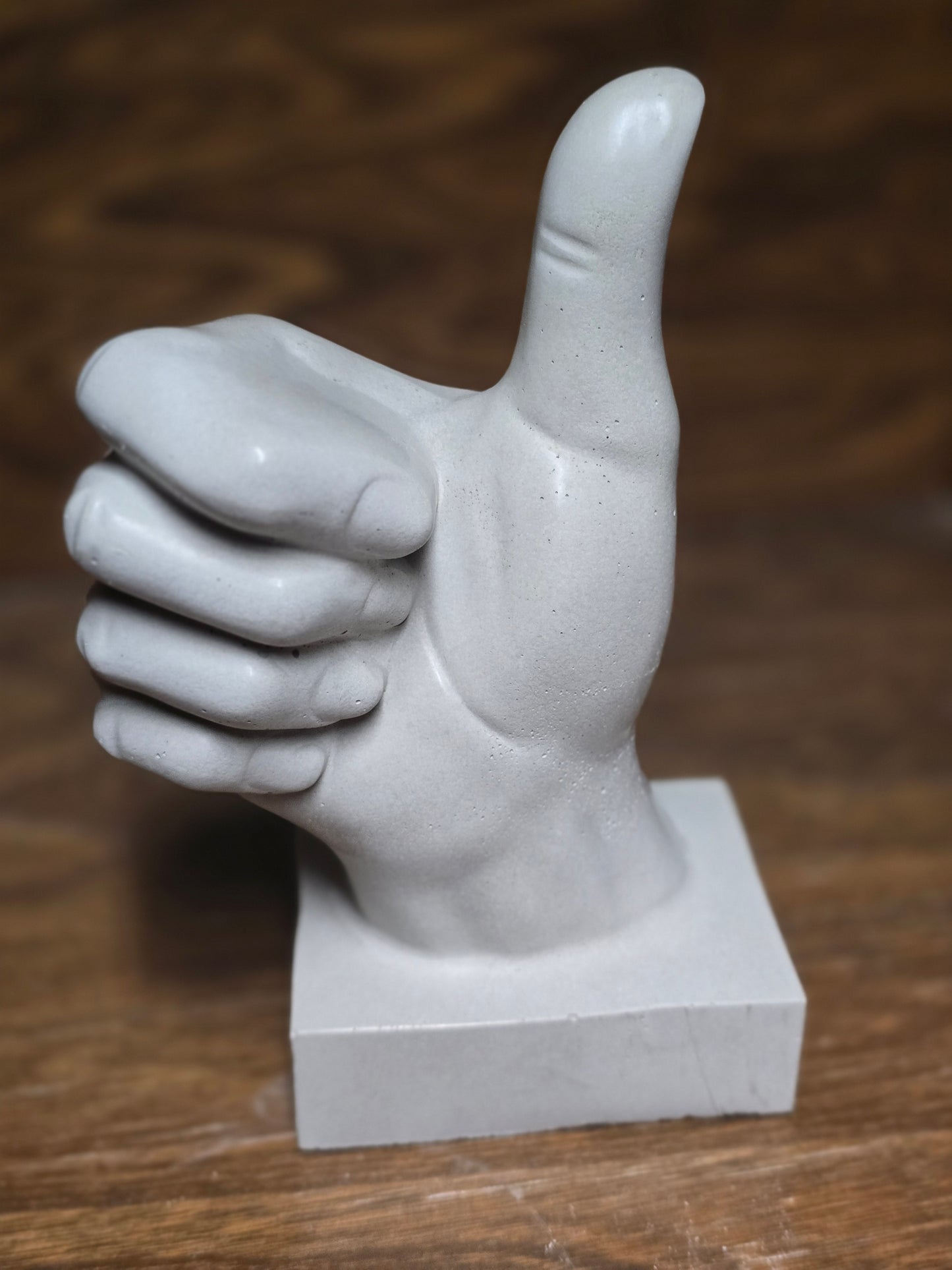 Hands with thumbs up Concrete
